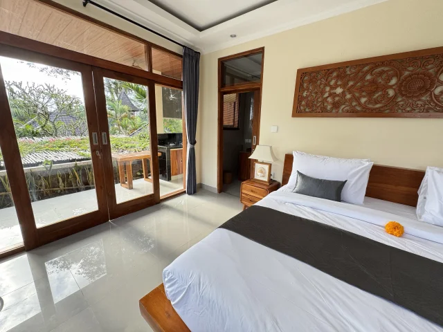 First floor bedroom with natural light at Jambangan Bali Villa Ubud