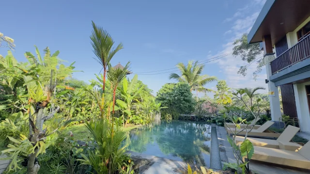 Private swimming pool surrounded by tropical greenery at Jambangan Bali Villa Ubud