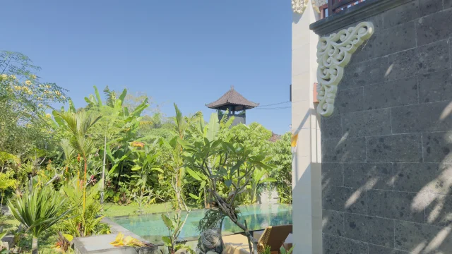 Poolside relaxation area at Jambangan Bali Villa Ubud